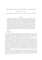 Stability of jets and wakes confined by compliant walls