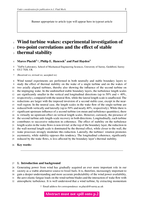 Wind turbine wakes: experimental investigation of two-point correlations and the effect of stable thermal stability